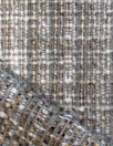 Italian tweedy boucle' wool blend woven with metallic glaze