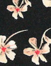 falling blossoms on black drapey rayon woven